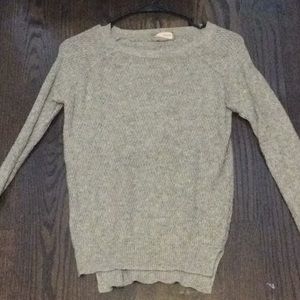 a gray sweater